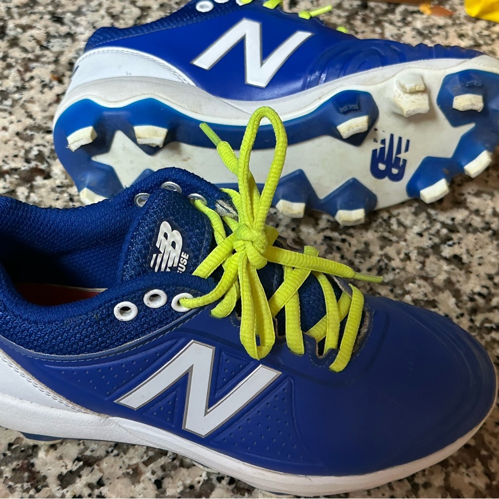 New Balance Size 5 blue and white cleats like new condition